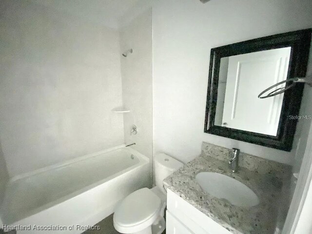 full bathroom with shower / washtub combination, vanity, and toilet