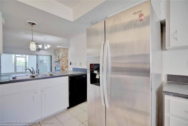4524 Lafayette Ave, Sebring, FL 33875 - kitchen featuring stainless steel fridge with ice dispenser, black dishwasher, dark countertops, a sink, and a textured ceiling