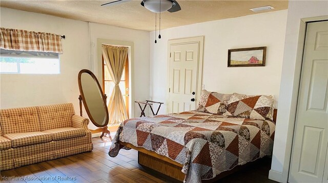 1723 Amber Ln, Lake Placid, FL 33852 - bedroom with wood finished floors and a ceiling fan