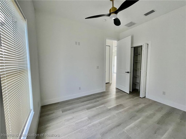 unfurnished bedroom featuring ceiling fan and light hardwood / wood-style floors