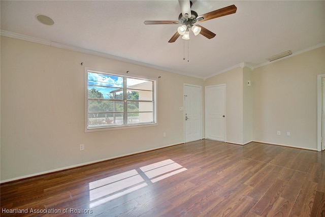 empty room featuring wood-type flooring, ceiling fan, and crown molding