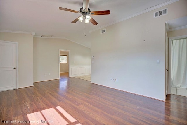 empty room featuring ceiling fan, dark hardwood / wood-style flooring, lofted ceiling, and ornamental molding