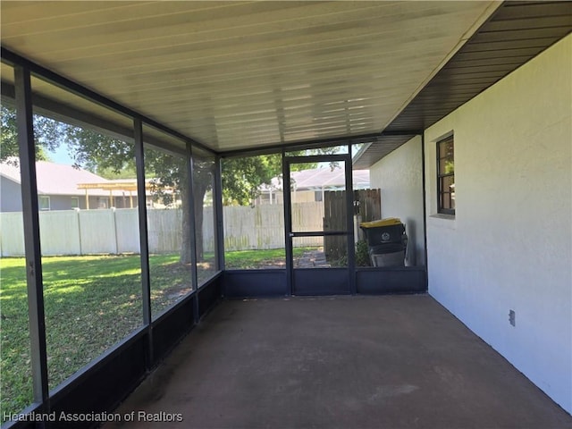 unfurnished sunroom with plenty of natural light