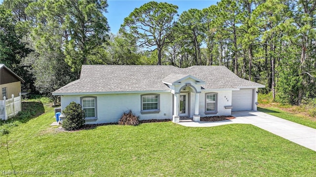 ranch-style house featuring roof with shingles, driveway, a front lawn, and stucco siding