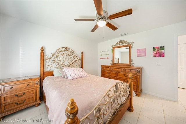 bedroom featuring light tile patterned floors, baseboards, visible vents, and a ceiling fan