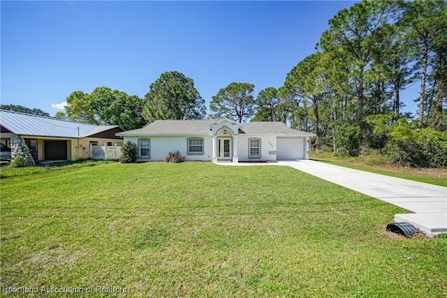 ranch-style home with a garage, a front yard, concrete driveway, and stucco siding