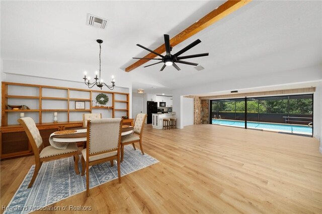 245 Lake Blvd, Sebring, FL 33875 - dining space featuring a chandelier, wood finished floors, and a ceiling fan