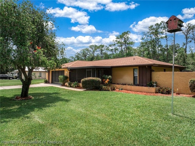 245 Lake Blvd, Sebring, FL 33875 - ranch-style house with concrete driveway, a garage, a front yard, and stucco siding