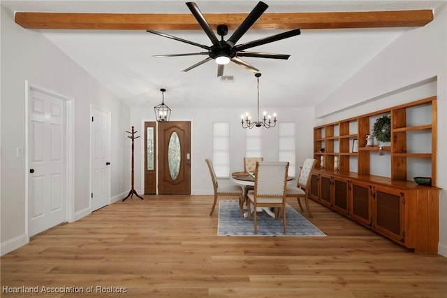 245 Lake Blvd, Sebring, FL 33875 - dining area featuring a chandelier, ceiling fan, and light wood finished floors