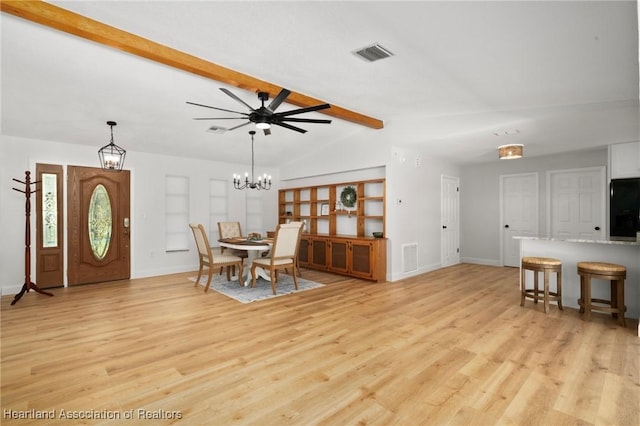 245 Lake Blvd, Sebring, FL 33875 - foyer with light wood-style floors, a chandelier, and a ceiling fan