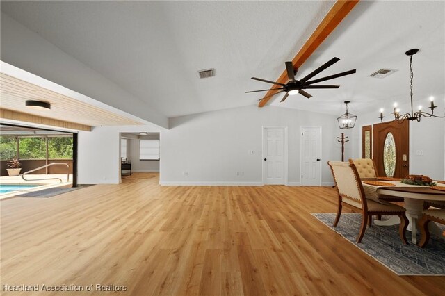 245 Lake Blvd, Sebring, FL 33875 - living room with light wood-style floors, a ceiling fan, and a chandelier