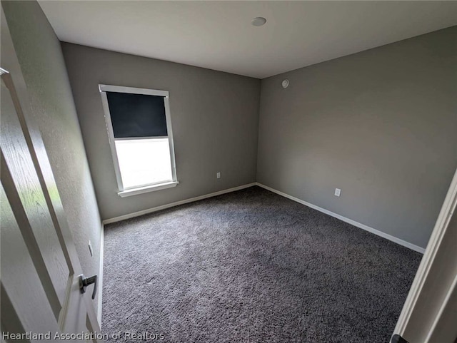 unfurnished room with carpet