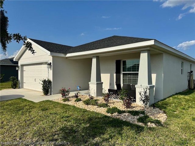 view of front of house with a front yard and a garage