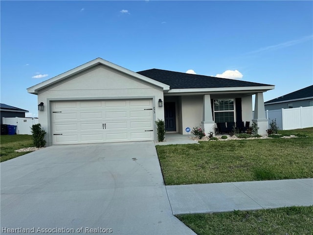 ranch-style house with a garage and a front lawn