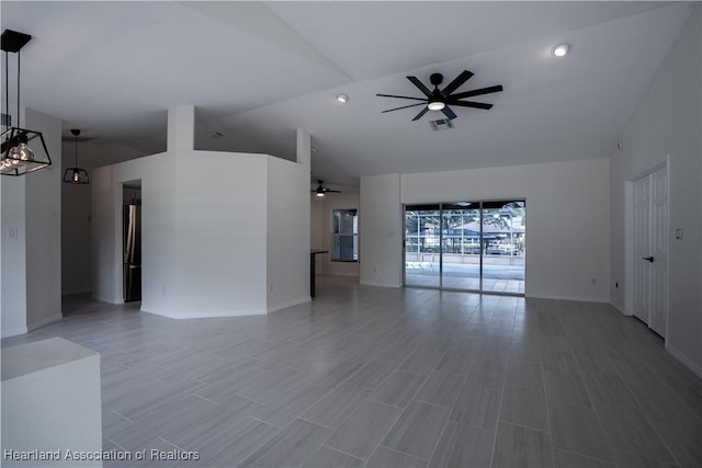 unfurnished living room with ceiling fan and lofted ceiling