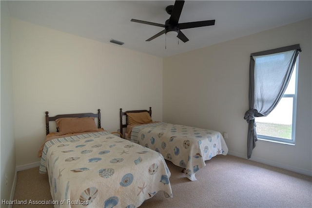 bedroom featuring ceiling fan and light colored carpet