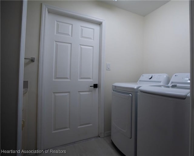 washroom with washer and clothes dryer