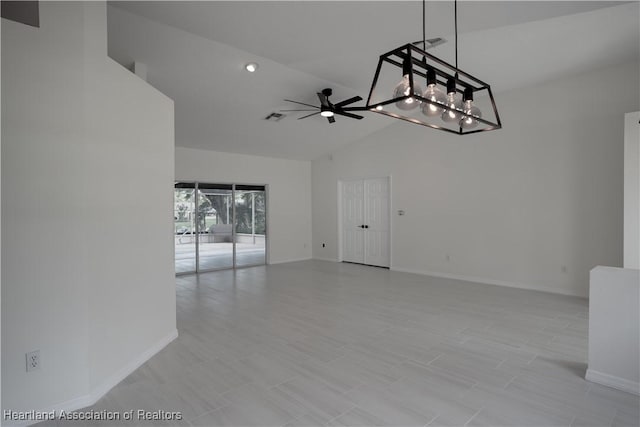 unfurnished room featuring ceiling fan and high vaulted ceiling