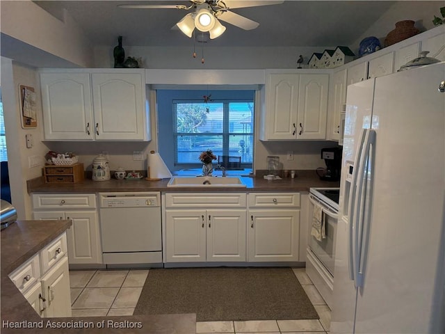 kitchen featuring white appliances, white cabinets, sink, ceiling fan, and light tile patterned floors