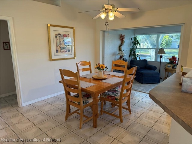 dining room featuring light tile patterned floors and ceiling fan