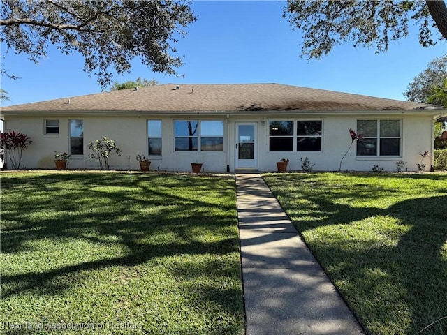 view of front of property with a front lawn