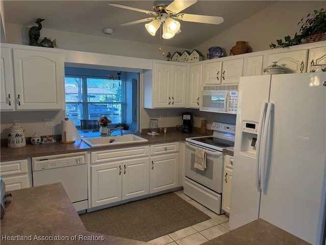 kitchen featuring white cabinets, white appliances, and sink