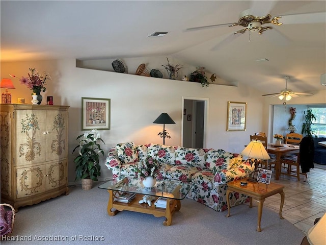 tiled living room with vaulted ceiling