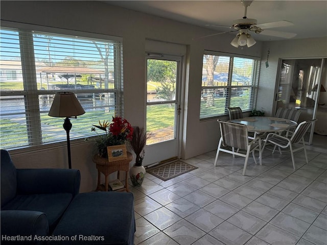 sunroom / solarium with ceiling fan