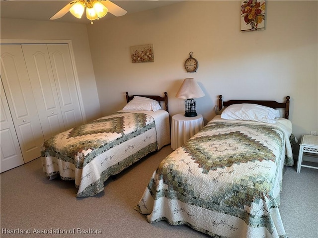 carpeted bedroom featuring a closet and ceiling fan