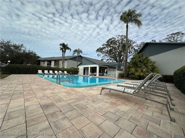 view of pool featuring a patio