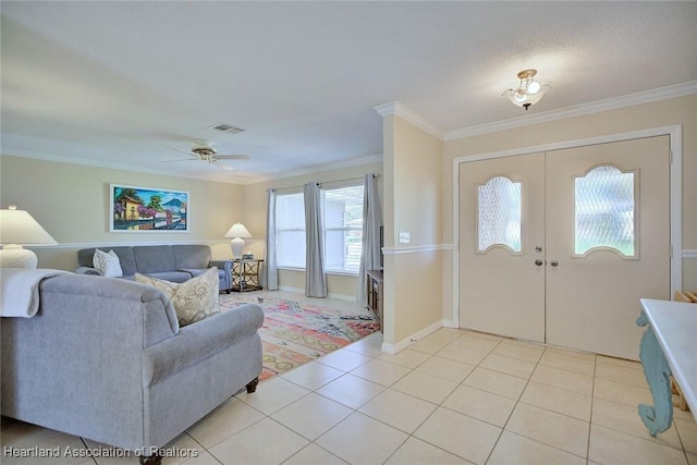 1712 Sunrise Pl, Sebring, FL 33870 - foyer with ornamental molding, french doors, light tile patterned floors, and ceiling fan