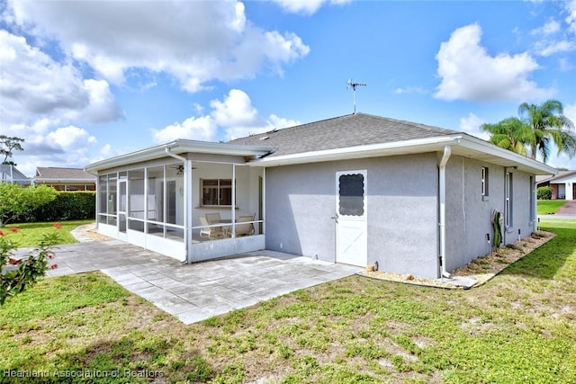 1712 Sunrise Pl, Sebring, FL 33870 - back of house featuring a sunroom, stucco siding, a yard, a patio, and roof with shingles