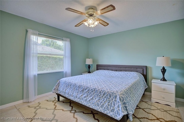 1712 Sunrise Pl, Sebring, FL 33870 - bedroom with baseboards and a ceiling fan