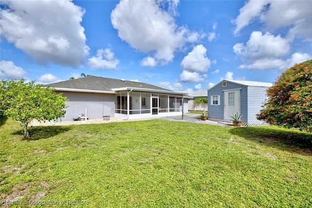 1712 Sunrise Pl, Sebring, FL 33870 - rear view of property with a sunroom, a lawn, a shed, and stucco siding