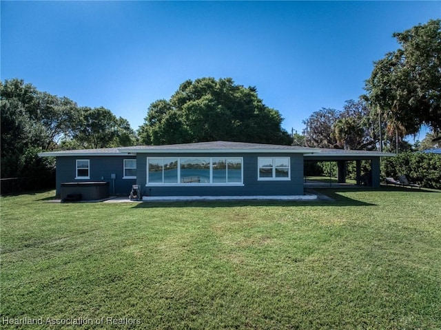1622 Dinner Dr, Sebring, FL 33870 - back of property with a carport and a yard