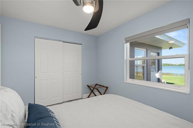 1622 Dinner Dr, Sebring, FL 33870 - bedroom featuring a closet, a ceiling fan, and a water view