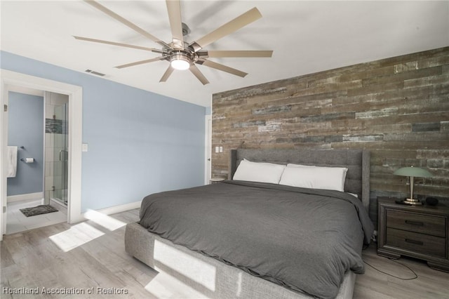 1622 Dinner Dr, Sebring, FL 33870 - bedroom with visible vents, baseboards, ensuite bath, and wood finished floors
