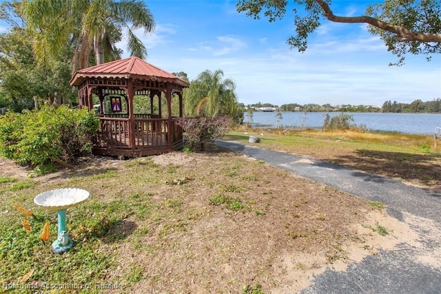 view of yard with a gazebo and a water view