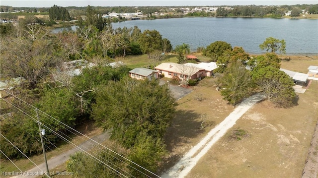 birds eye view of property with a water view