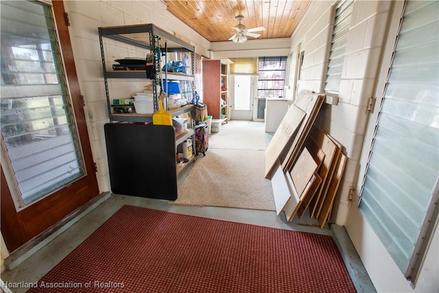 interior space with wooden ceiling and ceiling fan