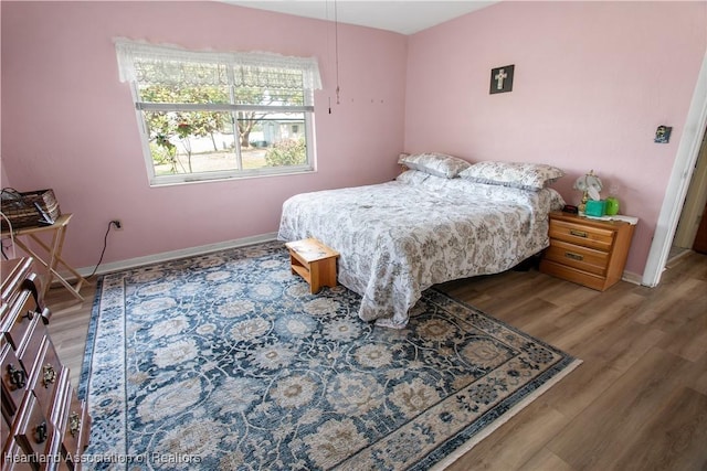 bedroom with wood-type flooring