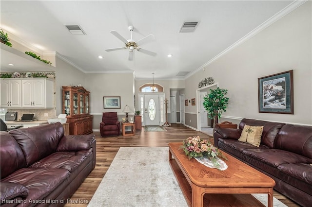 living room featuring ceiling fan, hardwood / wood-style floors, and ornamental molding