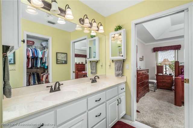 bathroom featuring vanity and crown molding