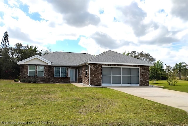 single story home with an attached garage, brick siding, concrete driveway, roof with shingles, and a front lawn