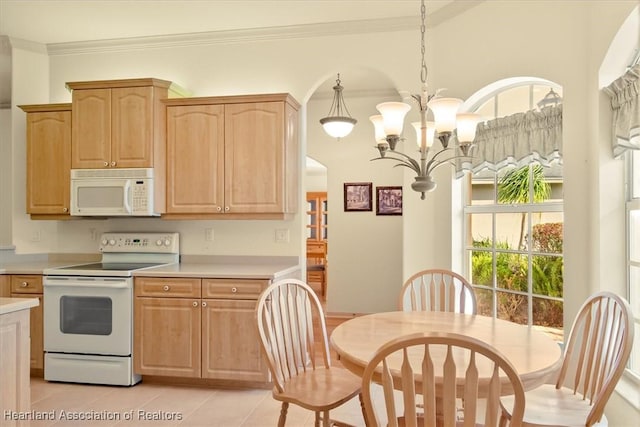 kitchen featuring white appliances, light tile patterned floors, light countertops, crown molding, and light brown cabinets