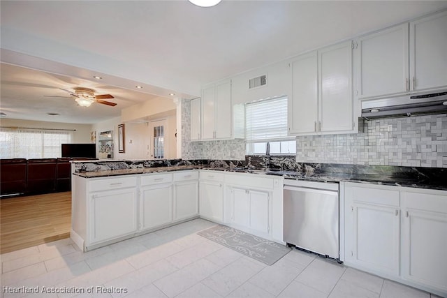 kitchen with dishwasher, white cabinets, a wealth of natural light, and black cooktop