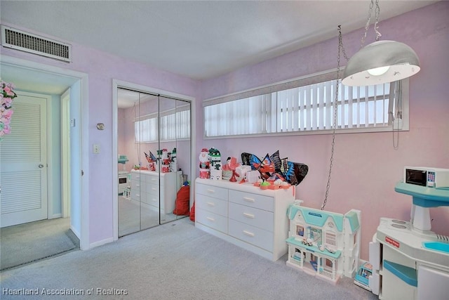 carpeted bedroom featuring a closet