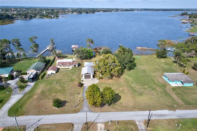 birds eye view of property with a water view