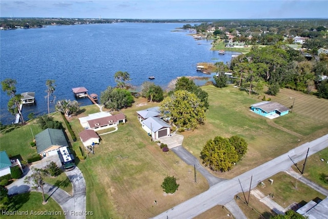 birds eye view of property featuring a water view