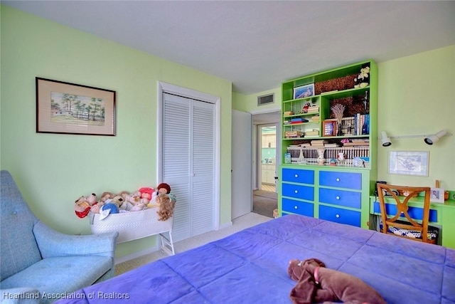 carpeted bedroom with a closet